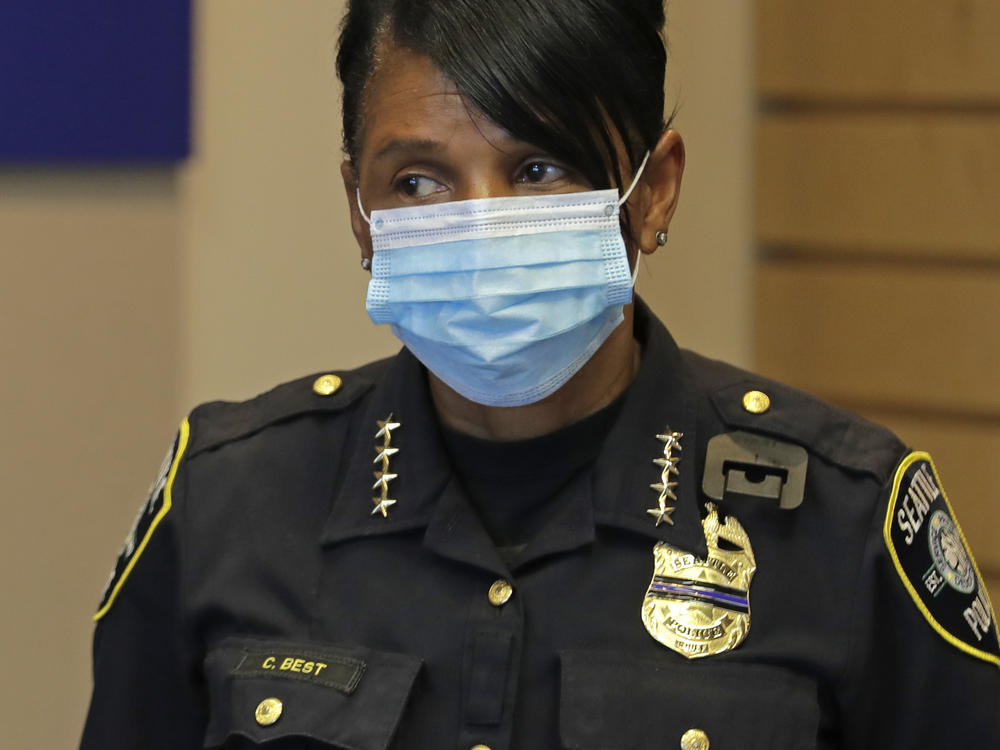 Police Chief Carmen Best listens during a news conference at City Hall in Seattle on July 13. Best is critical of a plan backed by several city council members that seeks to cut the police department's budget in half.