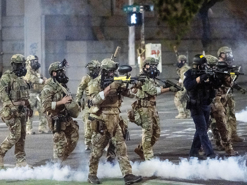 Federal agents use crowd control munitions to disperse protesters this week at the Mark O. Hatfield U.S. Courthouse in Portland, Ore.