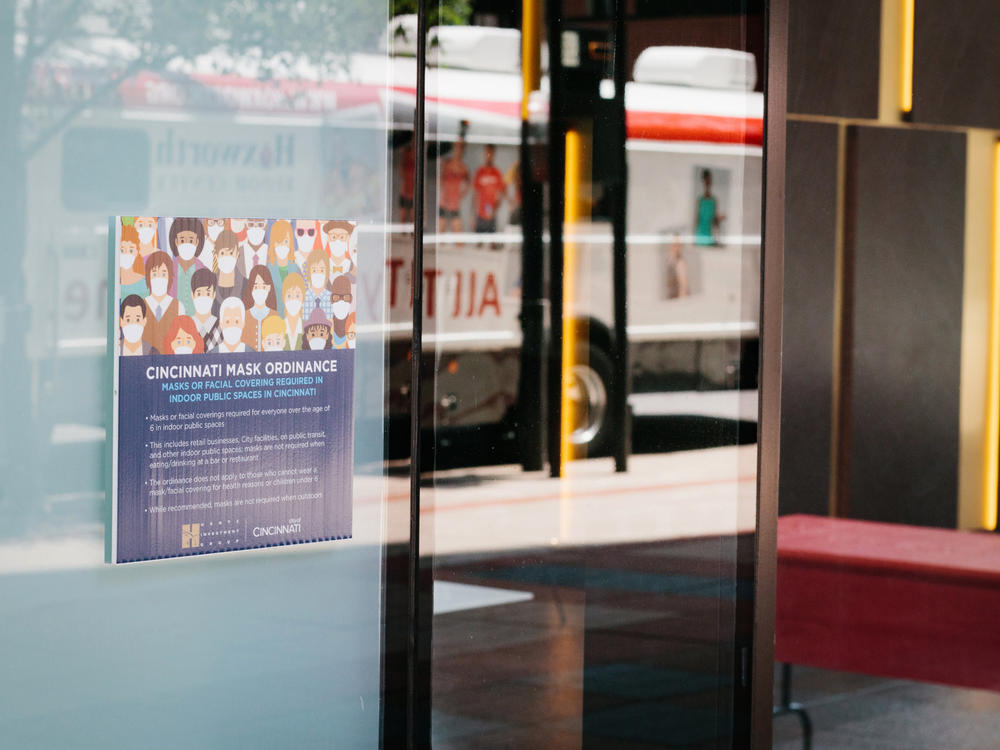 Signs advertise a local mask ordinance in Cincinnati, Ohio, earlier this month. Beginning Thursday evening, masks will be mandatory in public places statewide.