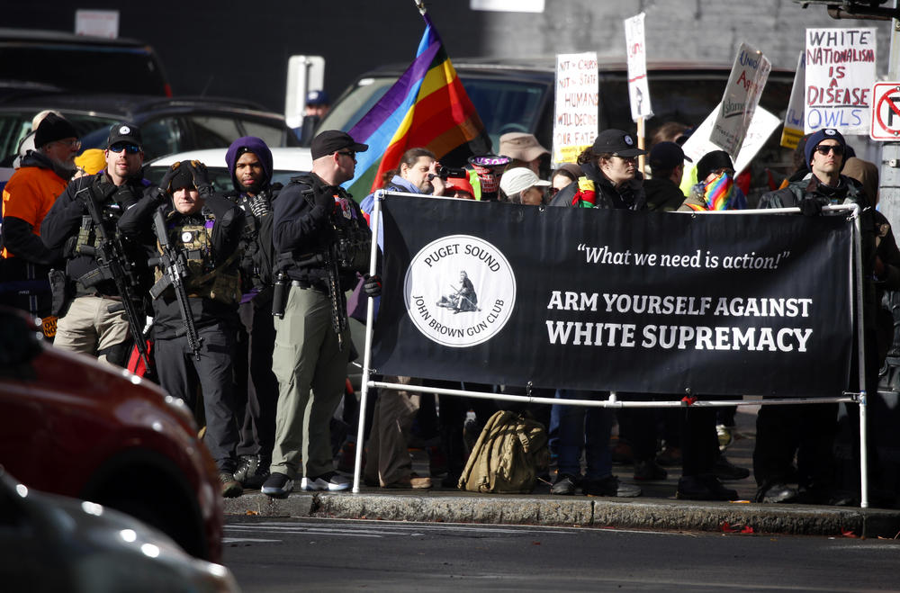 Members of the Puget Sound John Brown Gun Club provide security to counterprotesters at a far-right rally in Seattle on Jan. 5.
