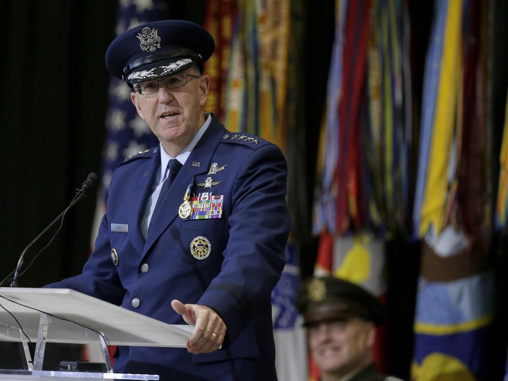 Air Force Gen. John Hyten speaks at Offutt Air Force Base in Nebraska during a change of command ceremony at U.S. Strategic Command in November. Joint Chiefs Chairman Gen. Mark Milley is behind, listening. Hyten is now vice chairman of the Joint Chiefs of Staff.