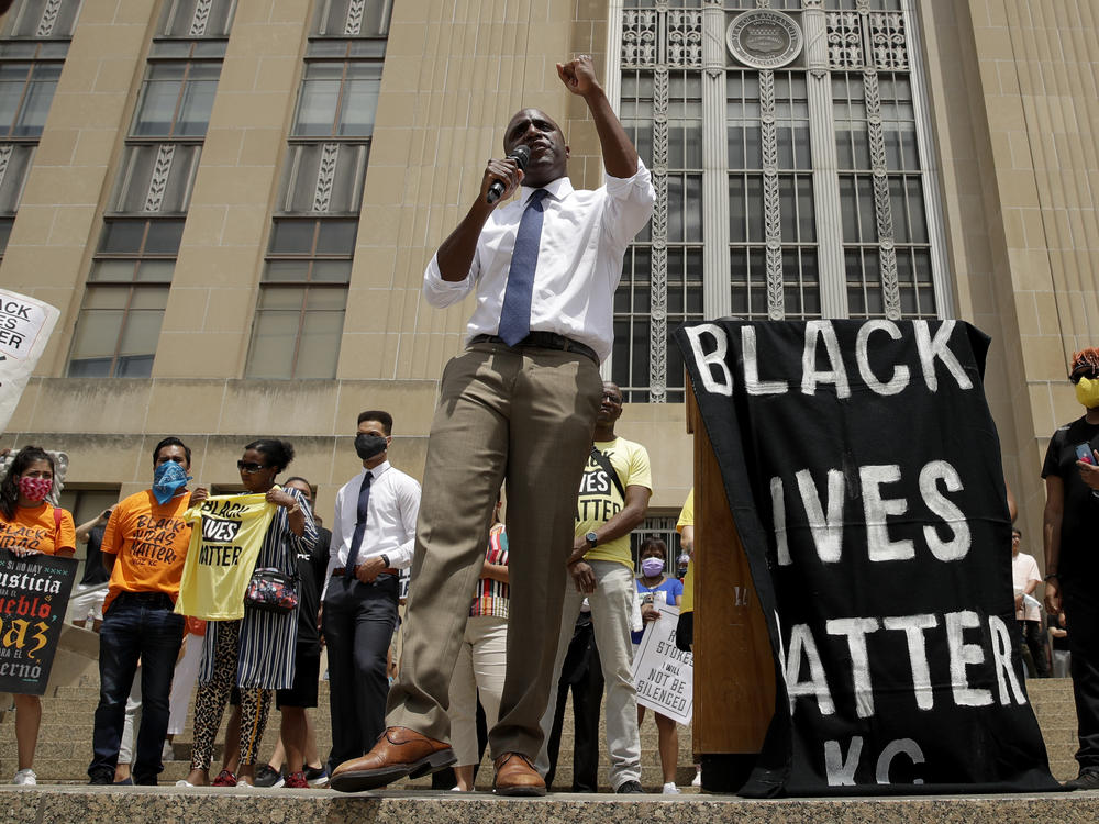 Mayor Quinton Lucas talks to demonstrators during a rally on the steps of City Hall in Kansas City, Mo., on June 5.