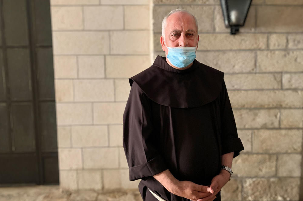 For months, Father Amjad Sabbara held a series of mini-Masses so everyone in his community could attend a socially distanced Mass at least once a month. But a second wave of infections afflicting Jerusalem's Palestinian neighborhood changed that.