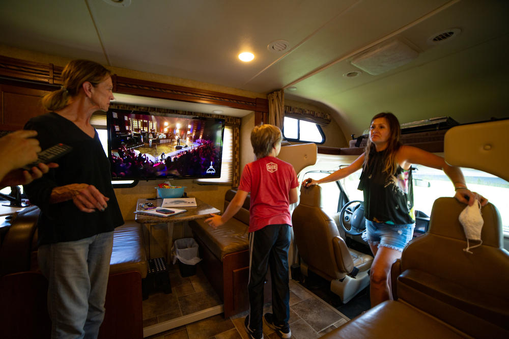Amy Holditch receives a two-hour tour of the RV, with instructions for how to operate everything inside and out. From left: Sandra Gillis, Duncan Holditch, and Amy Holditch.