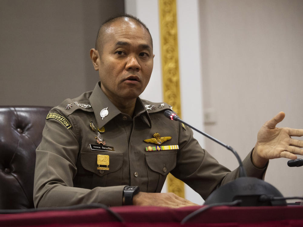 Police spokesman Col. Krissana Pattanacharoen talks to reporters during a news conference at police headquarter in Bangkok on Friday.