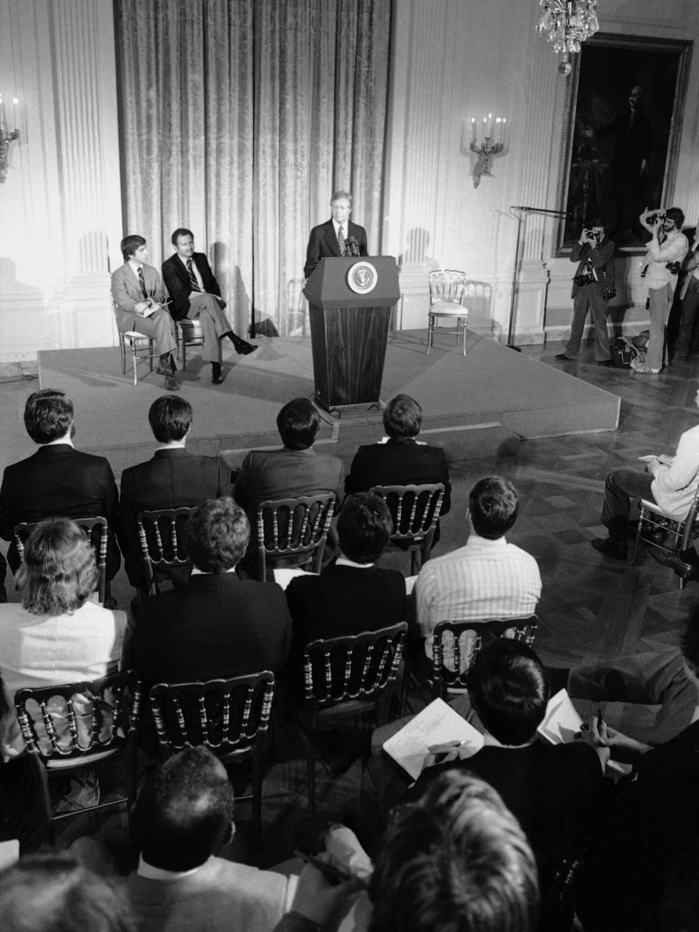 President Jimmy Carter addresses athletes at the White House who were to compete in the Moscow Summer Olympic Games on March 21, 1980. The president asked them to support his proposed boycott of the Games to punish the Soviets for their invasion of Afghanistan.