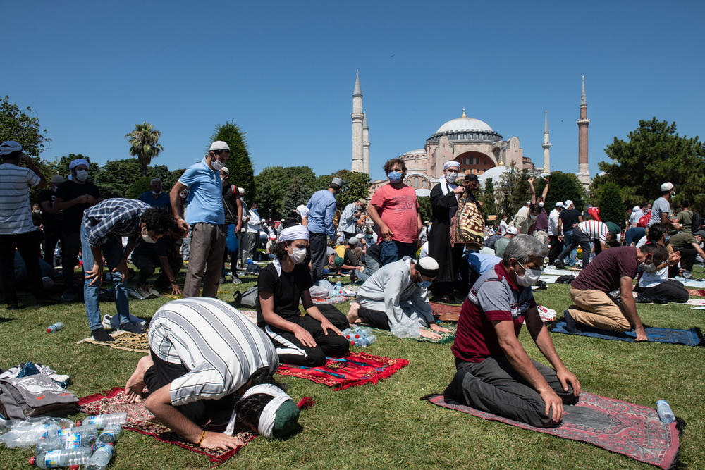 People pray outside Hagia Sophia during the first official Friday prayers since the famous building's conversion from a secular space into a Muslim house of worship.