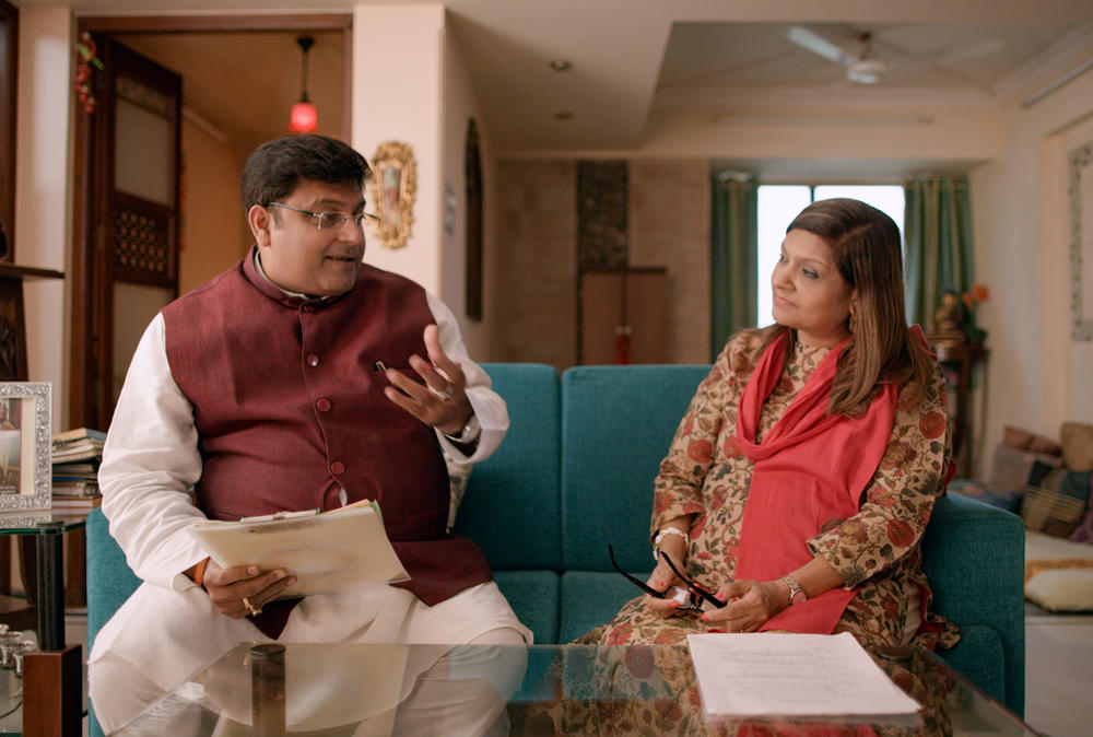 Sima Taparia (right) is a jet-setting matchmaker from Mumbai. Here she confers with astrologer Pundit Sushil ji, who helps her come up with prospective mates for her clients.