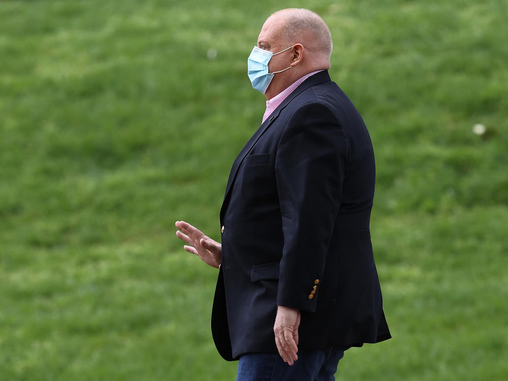 Maryland Gov. Larry Hogan arrives for a coronavirus briefing in front of the Maryland State House on April 17. Hogan's book <em>Still Standing </em>is out Tuesday.