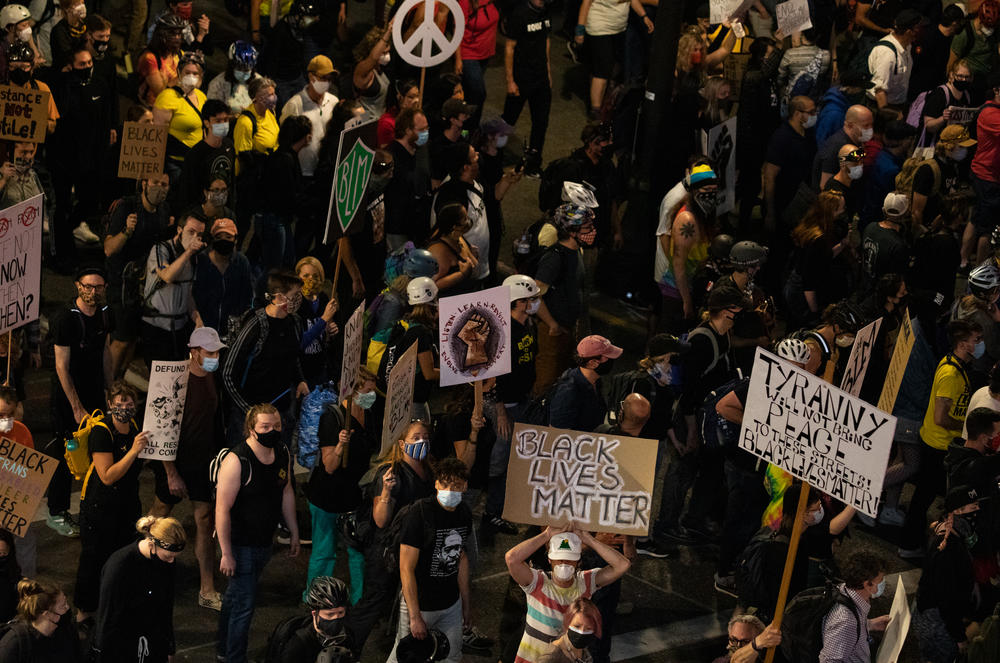 A subsection of the crowd marches toward the Marriott hotel in downtown Portland on Saturday.