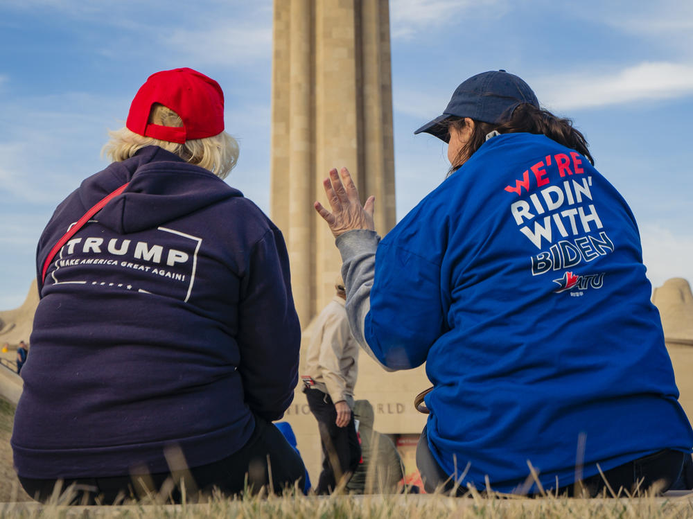 Supporters of President Trump and his Democratic challenger, former Vice President Joe Biden, talk in Kansas City, Mo.