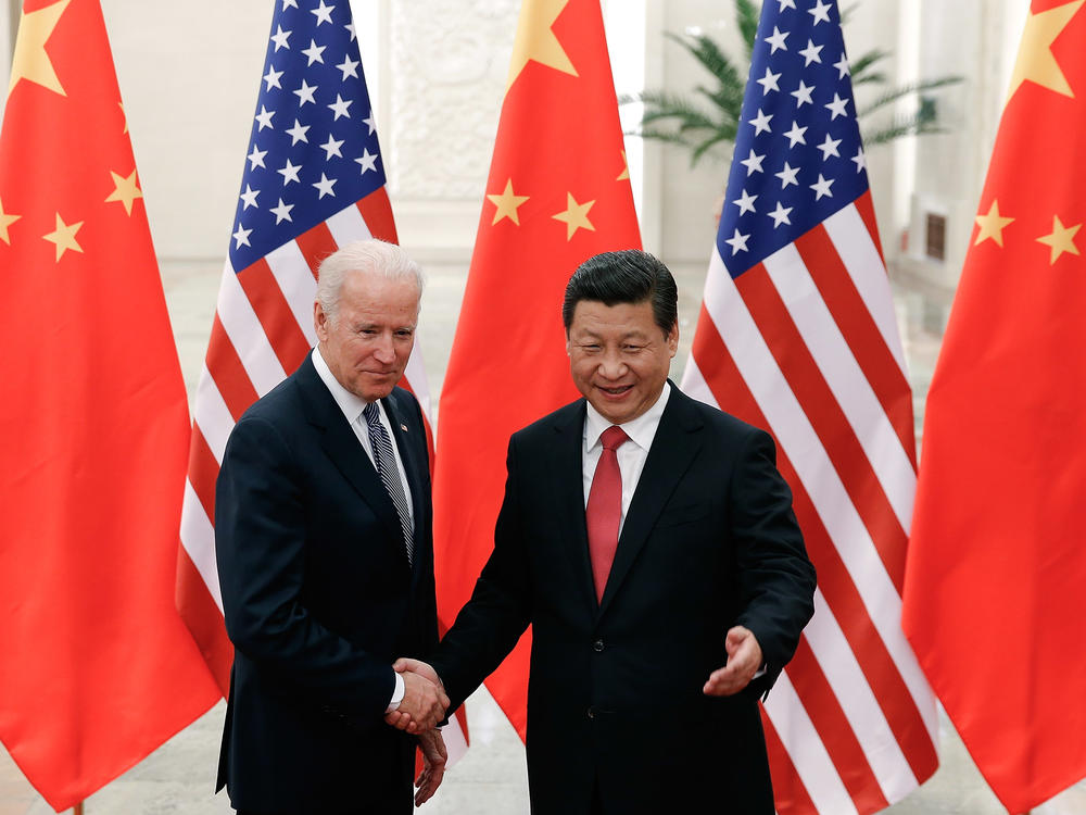 Then-Vice President Joe Biden shakes hands with Chinese President Xi Jinping in Beijing on Dec. 4, 2013. 