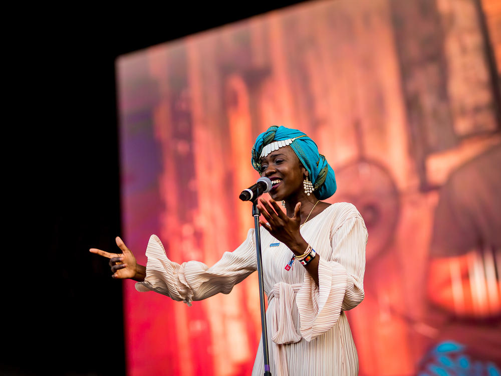 Slam poet and UNHCR Goodwill Ambassador Emi Mahmoud performs at the Sziget Festival in Hungary in 2019.