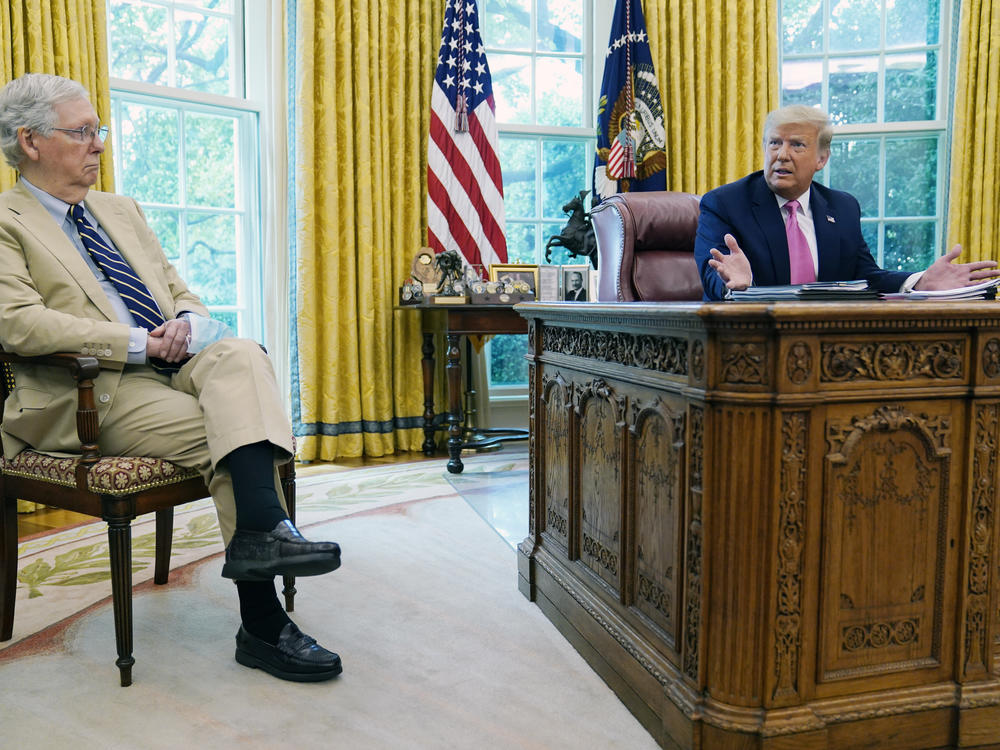 Senate Majority Leader Mitch McConnell, R-Ky., with President Trump at the White House. The Republican Party has unveiled a new pandemic relief bill, but tough negotiations lie ahead with Democrats.
