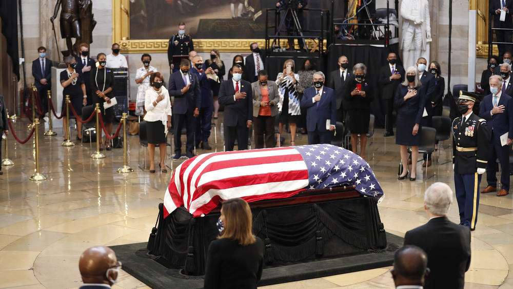Lewis' flag-draped coffin lies in state Monday in the Capitol Rotunda.