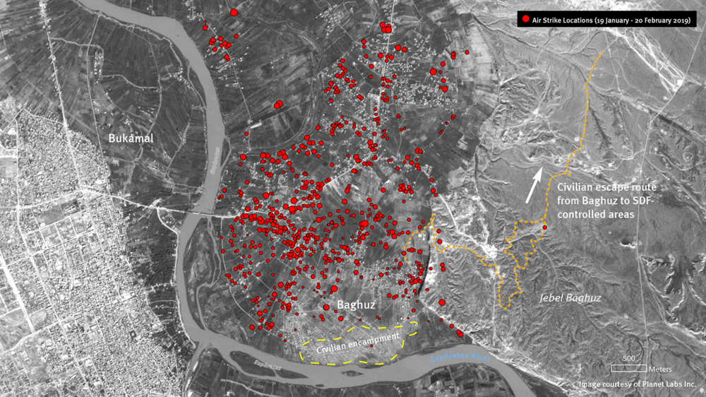 A satellite photo shows the eastern Syrian town of Baghouz, the last holdout of Islamic State fighters in early 2019. Satellite images revealed that many civilians remained in the town, leading to a pause in the bombing by the U.S. and its allies. The red dots, which were added by Human Rights Watch, reflect sites that were bombed.