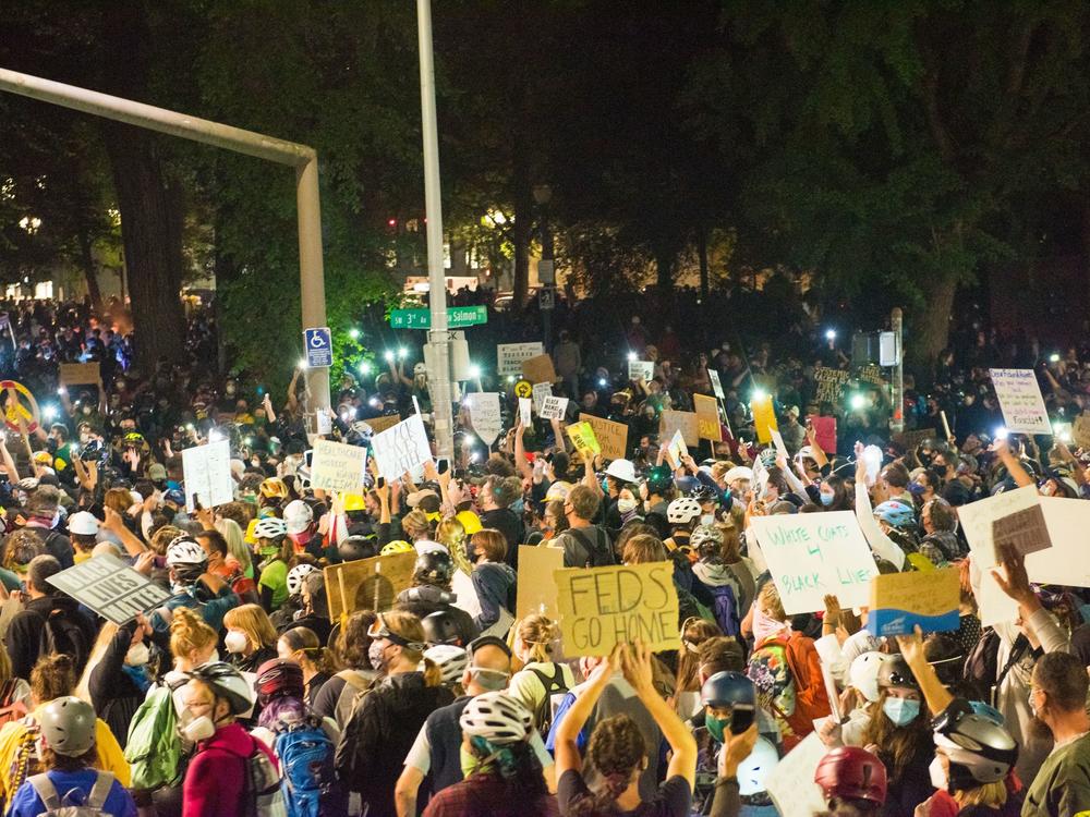 Protests in Portland, shown here on July 24, have grown increasingly heated with the presence of federal agents. On Monday, groups and individual protesters sued the federal government over its response.