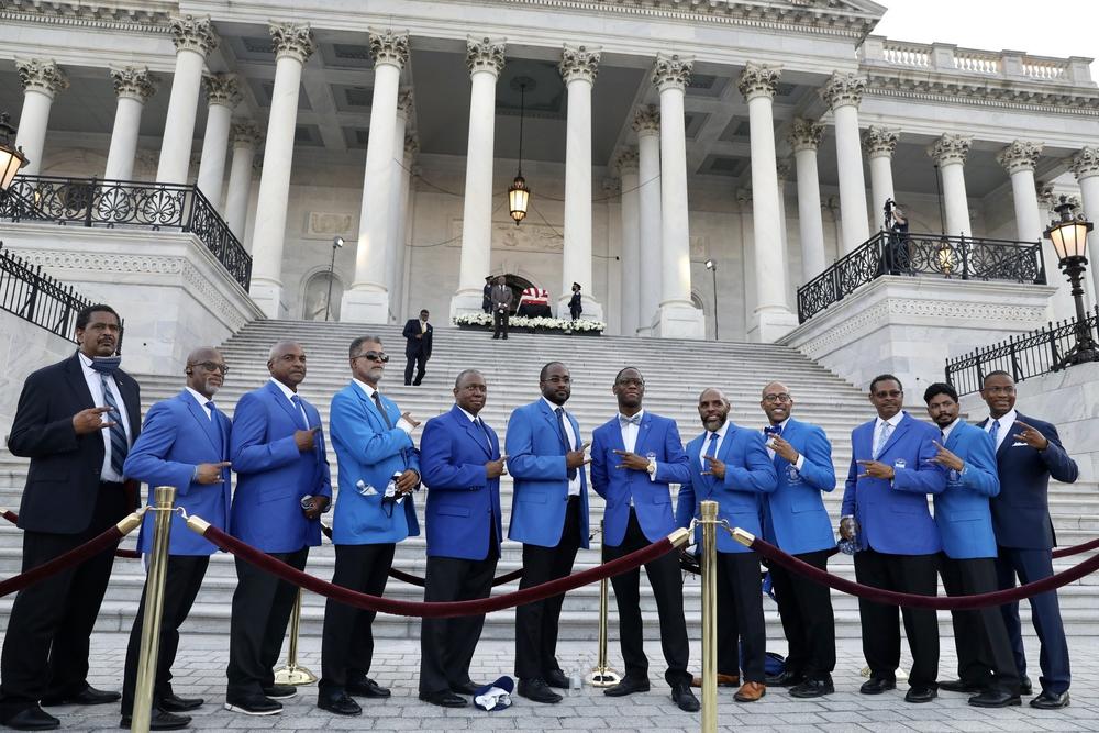 Members of Phi Beta Sigma, Rep Lewis' fraternity, hold hands and prepare to sing their fraternity's song. The members of the fraternity were from Fairfax, Va. and Montgomery County, Md.