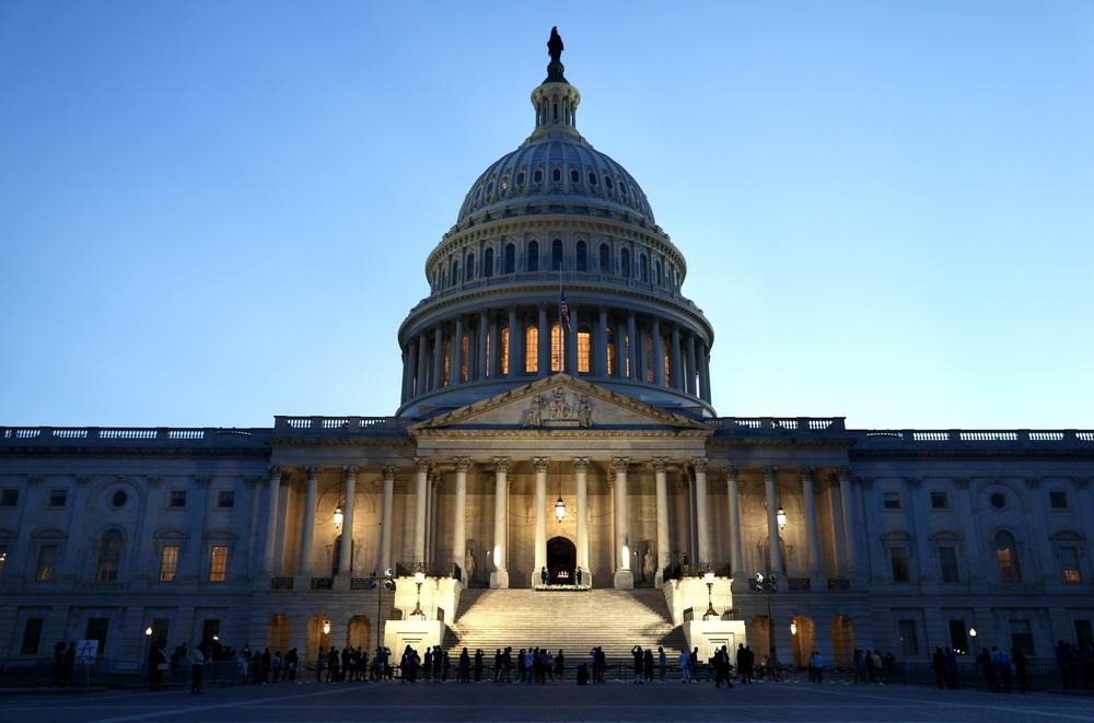Members of the public view the flag-draped casket bearing the remains of Rep. John Lewis (D-GA) at the East Front Steps of the U.S. Capitol.