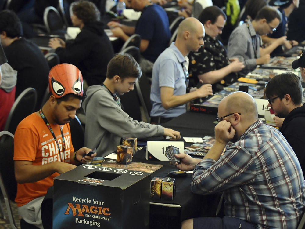 Players compete in a <em>Magic: The Gathering</em> tournament at Hasbro's HASCON in 2017.