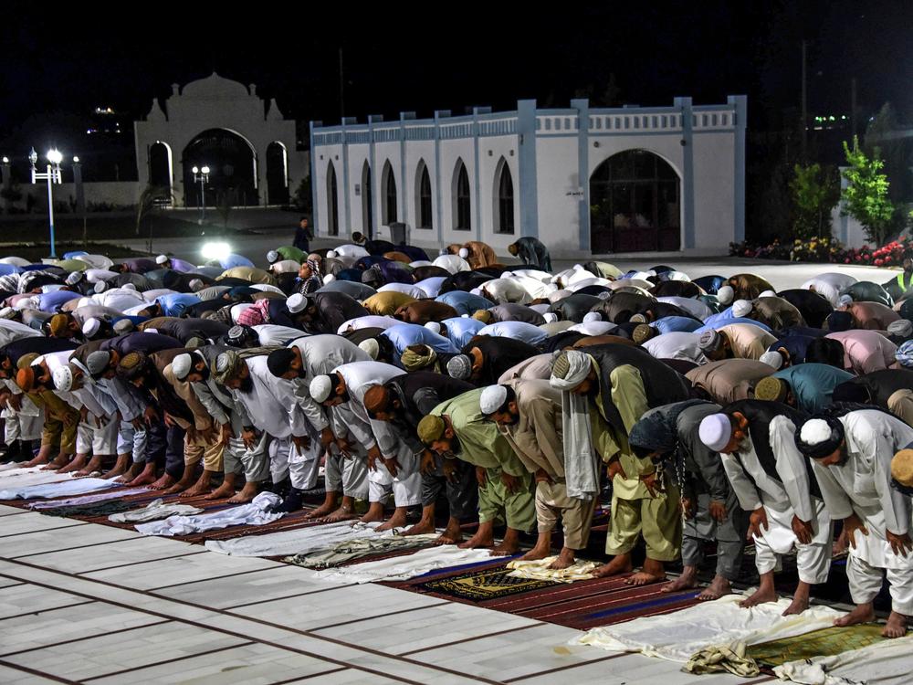 Muslims partake in evening prayers at a mosque in Kandahar, Afghanistan, in April. The Taliban have declared a cease-fire for an upcoming holiday.