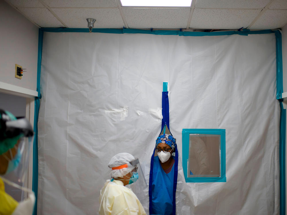 Healthcare workers talk in the Covid-19 unit at United Memorial Medical Center in Houston, Texas in July.