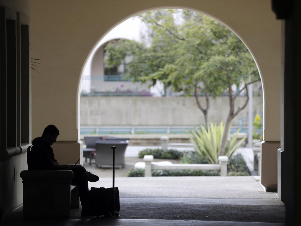 A man studies on the San Diego State University campus on March 12. San Diego State is a part of the California State University system and will be subject to the new general education requirement.