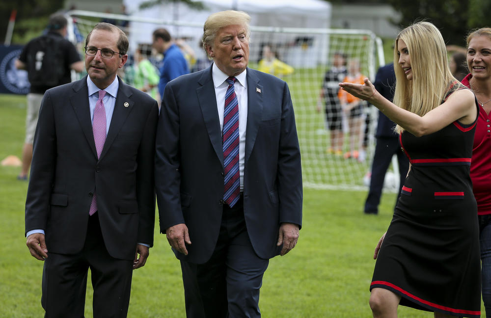 President Trump, Health And Human Services Secretary Alex Azar and Ivanka Trump walk together on the South Lawn of the White House on May 30, 2018.