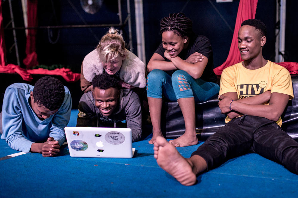 To figure out how to improve their technique, Zip Zap performers watch a video clip after rehearsals at the Zip Zap dome, the Cape Town for the circus.