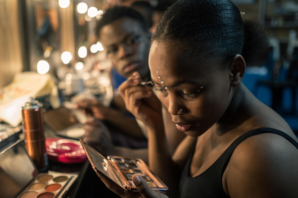 Inathi Zungula gets ready for her act backstage during a Zip Zap performance in Cape Town, South Africa. A contortionist and acrobat, she was so dedicated to making it in the circus that she made a 7-hour roundtrip commute by train to attend Zip Classes training twice a week.