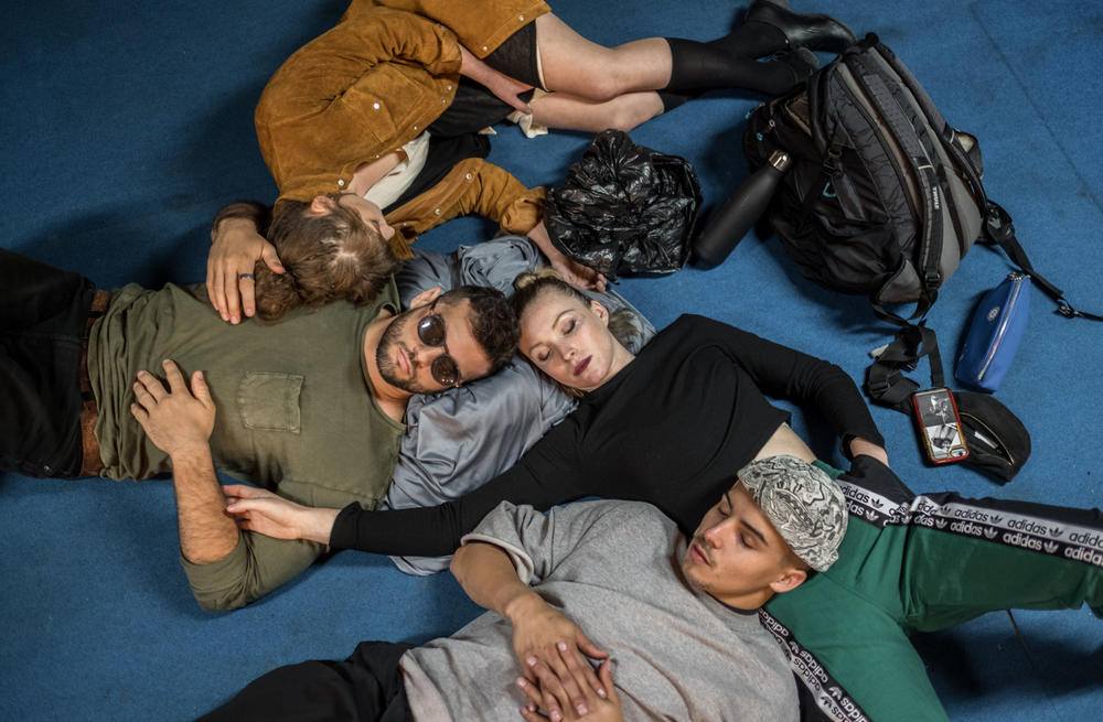 Circus performers including Sabine van Rensburg, the daughter of Zip Zap's founder, asleep backstage after a performance in Cape Town, South Africa.