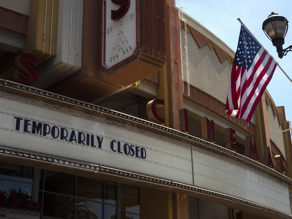 A movie theater is seen closed due to the coronavirus pandemic on July 2, 2020, in Brea, Calif. The U.S. economy shrank at a record 32.9% rate in the second quarter as the pandemic cost tens of millions of jobs.