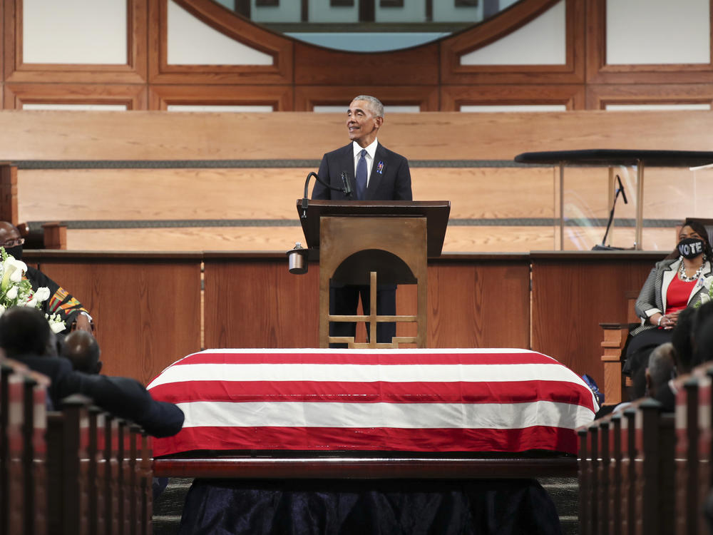 Former President Barack Obama pays tribute to the late Rep. John Lewis, D-Ga., during services Thursday at Ebenezer Baptist Church in Atlanta.