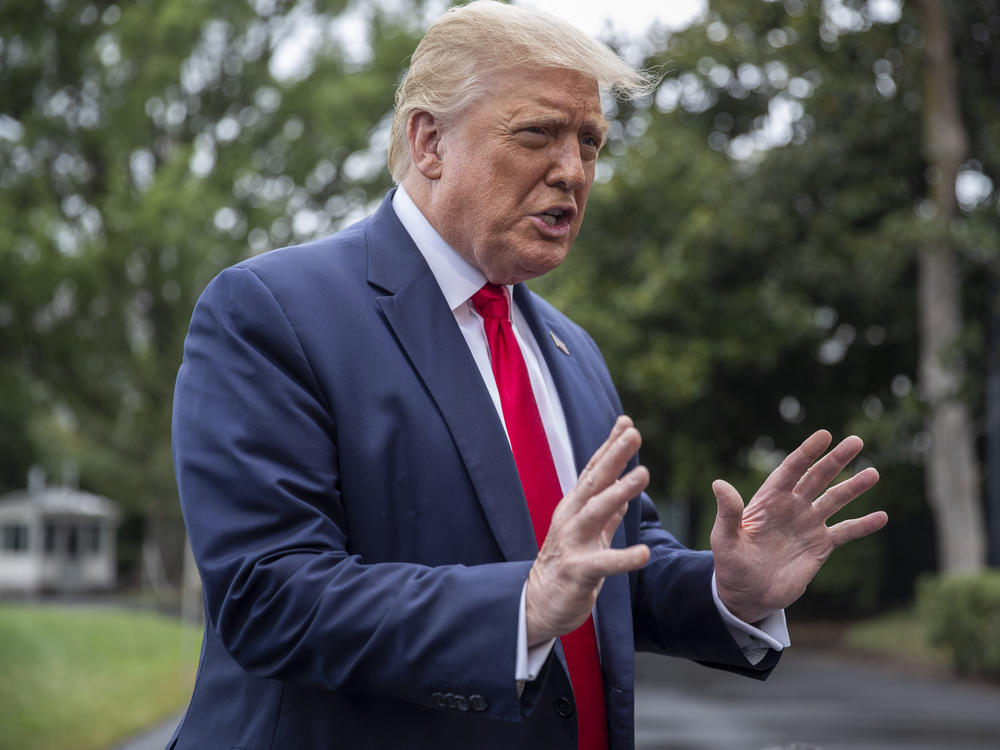 President Donald Trump chats with reporters Friday as he heads to Marine One on the South Lawn of the White House. The day before, he floated the idea of delaying the election, prompting criticism from the Federalist Society's co-founder.