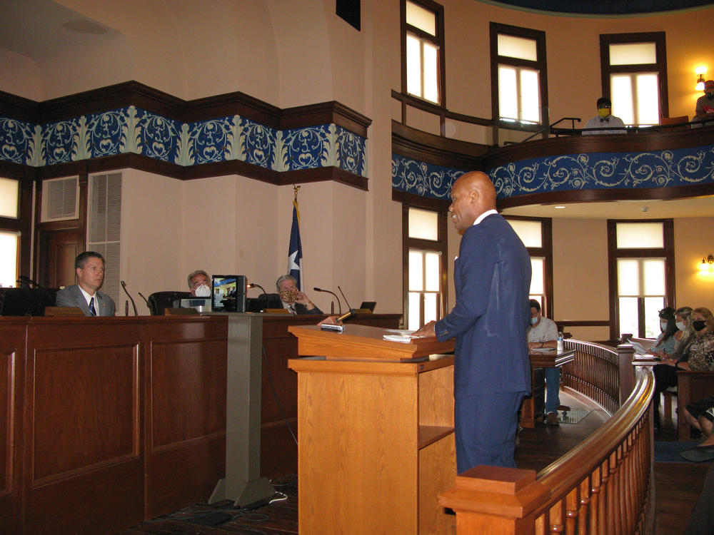 Herman Felton, president of local Wiley College, makes a presentation to commissioners: 