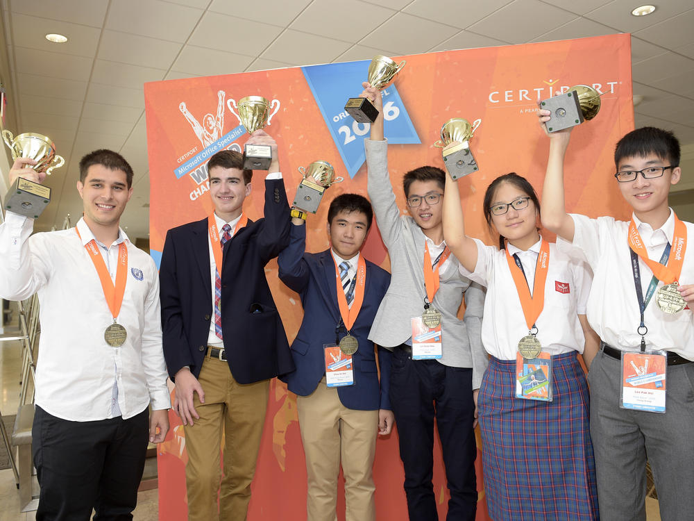 Gold medal winners Georgi Boshev, Ryan Catalfu, Ka Hei Chao, Kuan Hou Lei, Lai Tin Ming and Pak Hei Lee show off their trophies during the Pearson VUE Certiport Microsoft Office Specialist World Championship in 2016. The 2020 World Championships were cancelled due to the COVID-19 pandemic.
