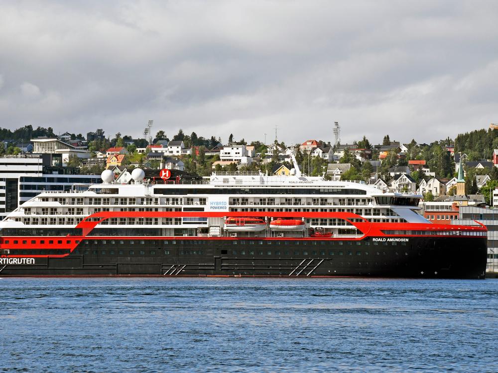 The expedition cruise ship MS Roald Amundsen is moored at a quay in Tromso, Norway, on Saturday. At least 36 crew members from the ship have tested positive for the coronavirus.