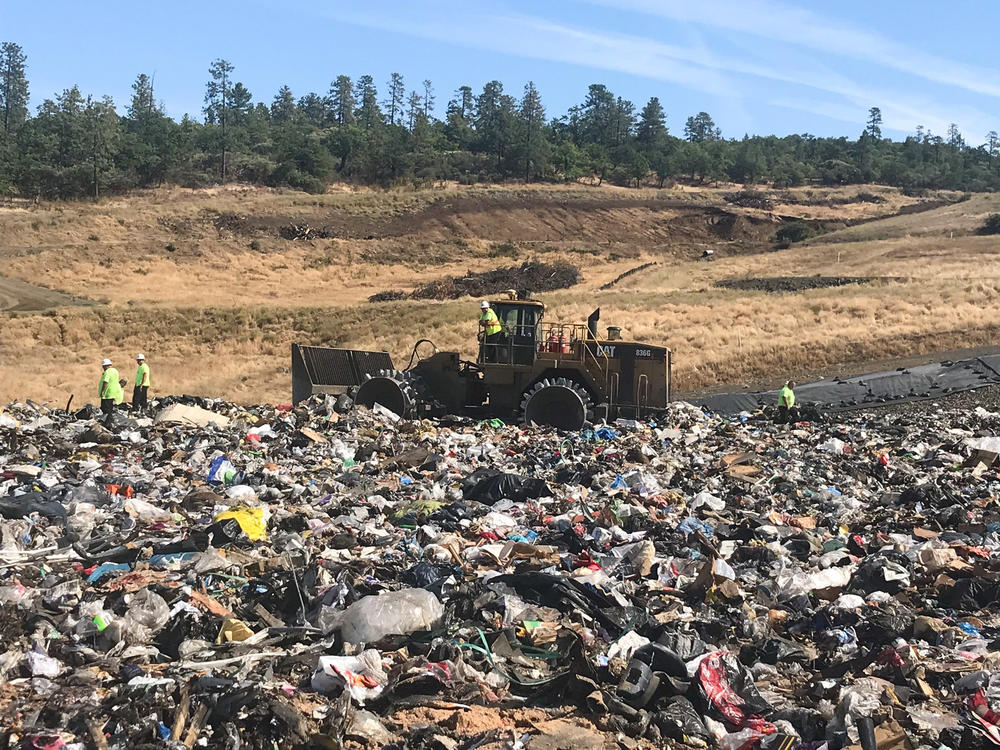 Landfill workers bury all plastic except soda bottles and milk jugs at Rogue Disposal & Recycling in southern Oregon.