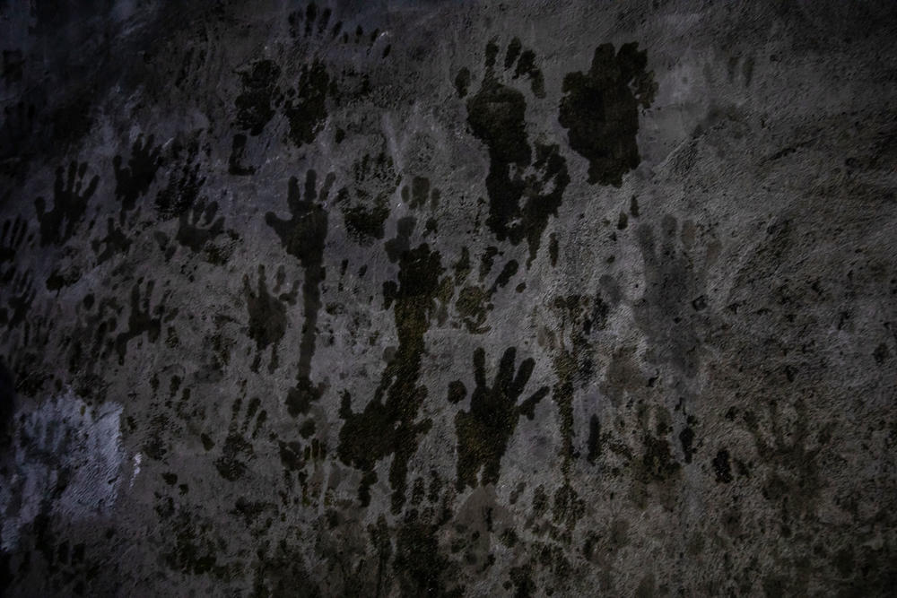 Handprints are left in the mountaintop temple of Lalish in northern Iraq — the holiest site in the Yazidi faith. Since the genocide, religious elders have conducted a ritual here to religiously purify women held captive by ISIS.
