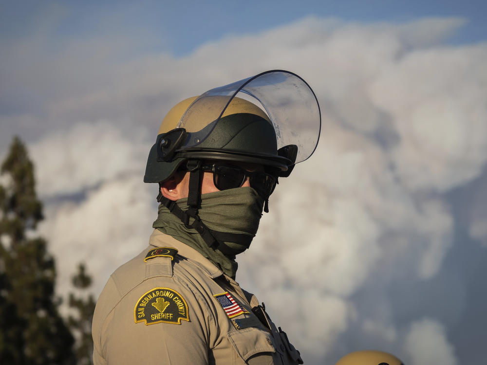 A San Bernardino County sheriff's deputy at a Black Lives Matter protest this month. The national debate following the death of George Floyd has raised questions about 'qualified immunity' for cops.