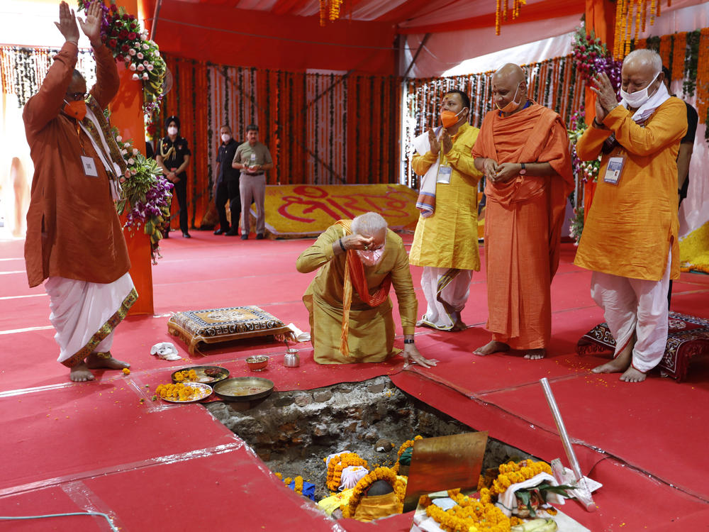 Indian Prime Minister Narendra Modi, center, performs the groundbreaking ceremony of a temple dedicated to the Hindu god Ram, watched by Rashtriya Swayamsevak Sangh (RSS) chief Mohan Bhagwat, right, and others in Ayodhya, India, on Wednesday.