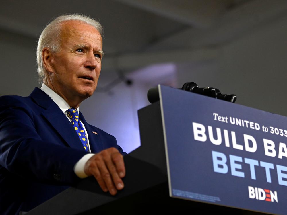 Presumptive Democratic nominee Joe Biden, seen here at a campaign event in July, says he won't tear down the border wall put in place during the Trump administration.