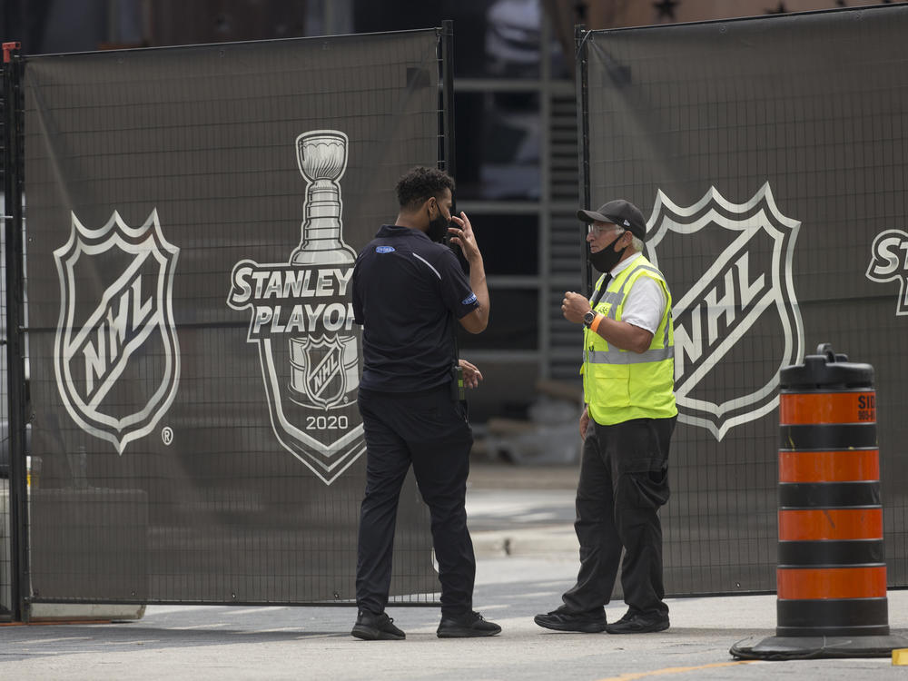 Personnel enter and exit the NHL bubble in Toronto, one of two host cities, along with Edmonton, where the league has resumed its season.