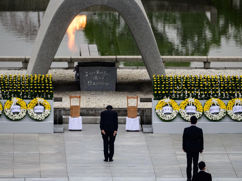 Japanese Prime Minister Shinzo Abe bows Thursday in front of a memorial to people who were killed in the 1945 atomic bombing of Hiroshima.
