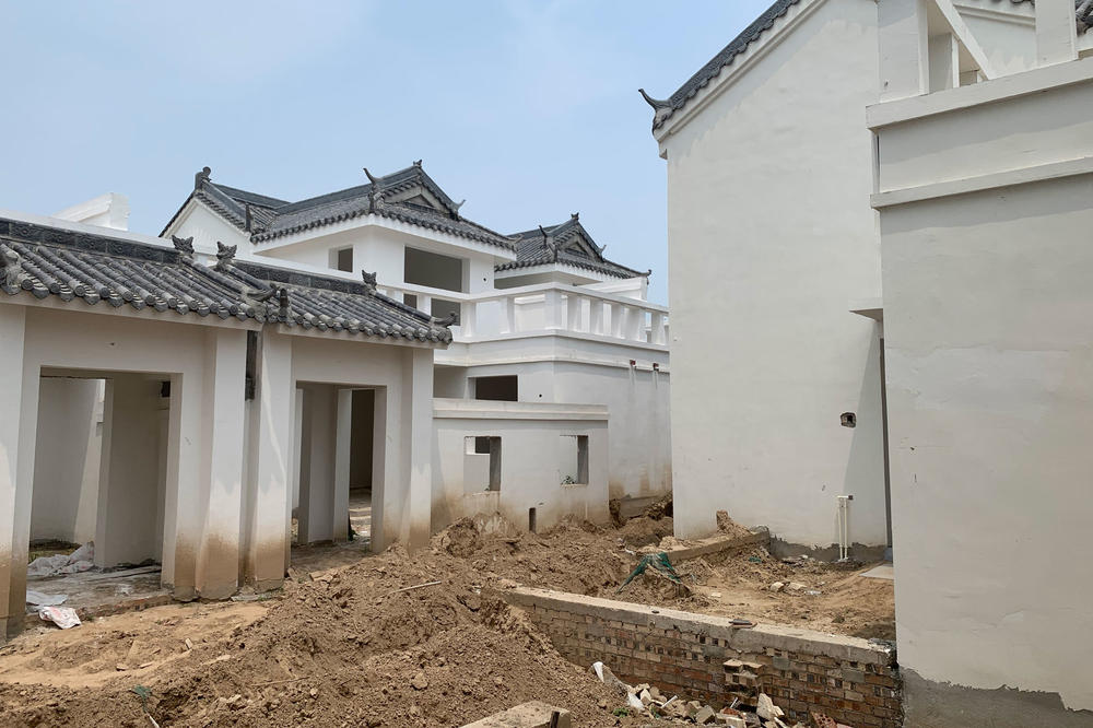 Homes under construction that villagers in Xiguozhuang and Liushuanglou are being asked to buy and move into. The houses are aesthetically pleasing, says Liu, but they are incompatible with the rural lifestyle. For example, farmers require a large yard to dry their crops after harvest each season.
