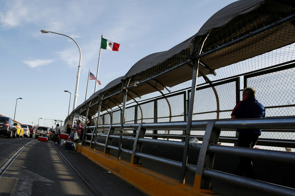 A man crosses the Paso del Norte border bridge toward El Paso, Texas, as seen from Ciudad Juárez, Mexico, on July 1. Since March, U.S. immigration officials have turned away tens of thousands of migrants, including asylum-seekers and unaccompanied children.