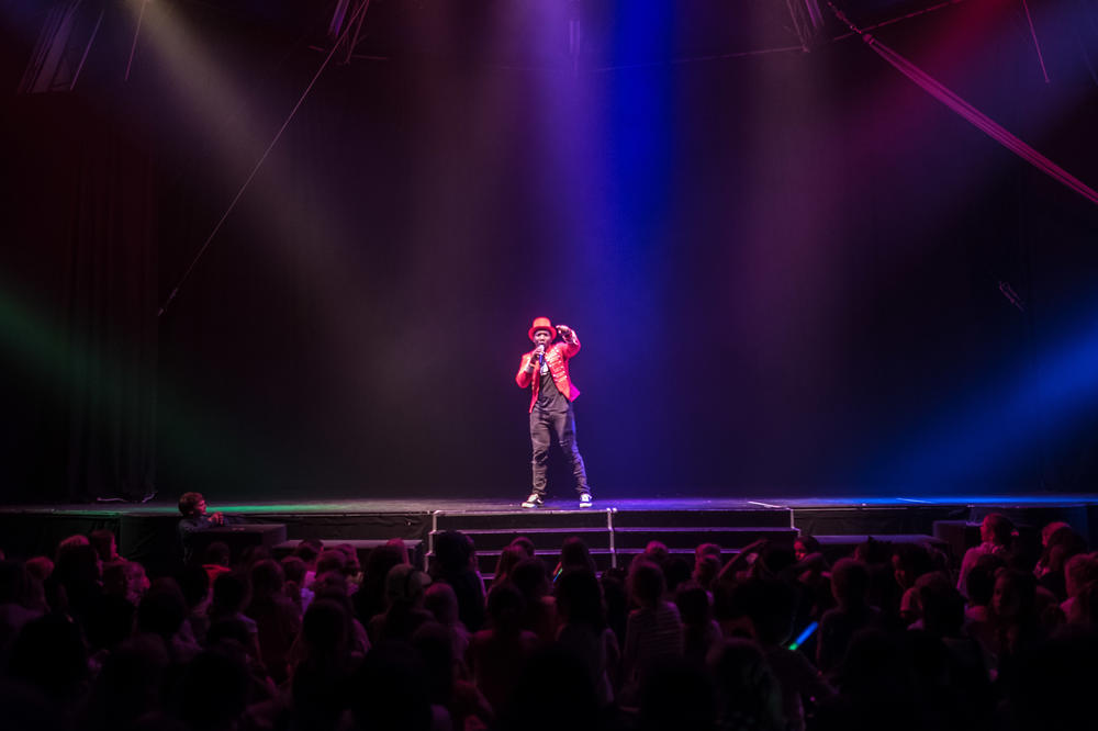 An emcee addresses a sellout crowd at the Zip Zap dome during a 2019 performance.