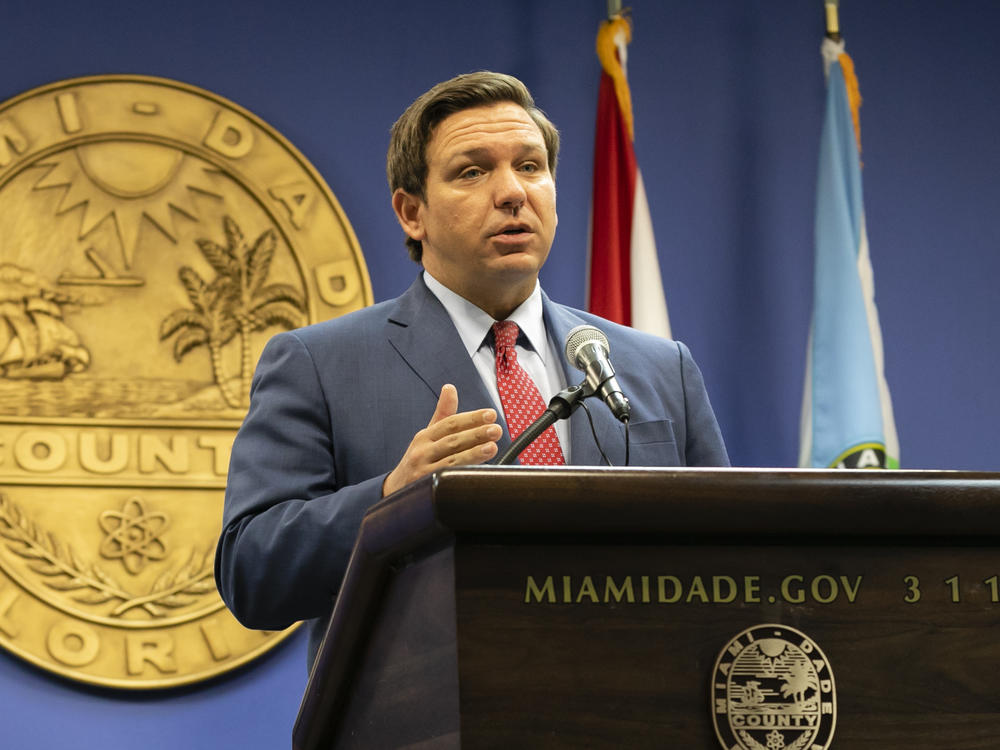 Florida Gov. Ron DeSantis, here in June, said this week that the state's troubled unemployment portal was designed to discourage people applying for benefits. The portal launched in 2013 under then-Gov. Rick Scott, now a U.S. senator.