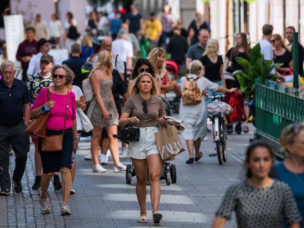 People walk in Stockholm on July 27, most without the face masks that have become common on the streets of many other countries as a method of fighting the spread of the coronavirus.