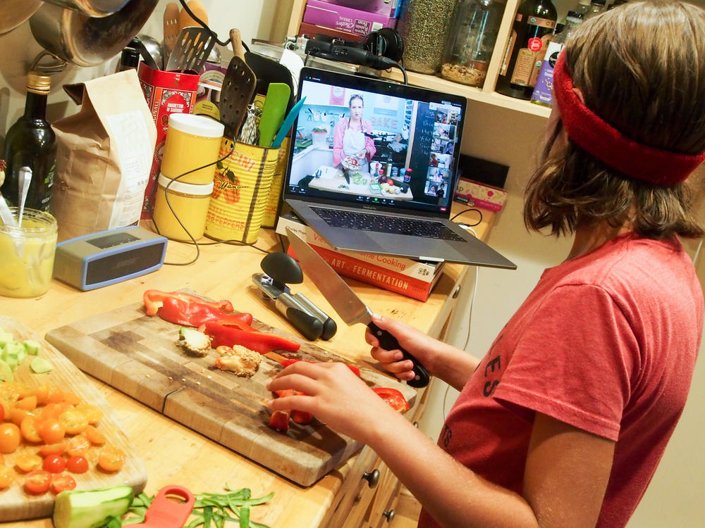 Wiley James, 10, prepares a meal as part of an online cooking camp run by a chef in Austin, Texas.